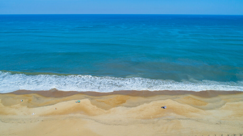 drone image of the beach and ocean