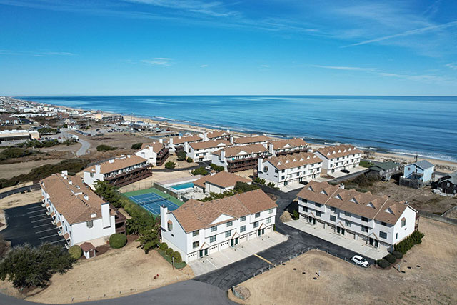 Aerial view of Seadunes Townhomes with ocean in background in Kitty Hawk, NC. 